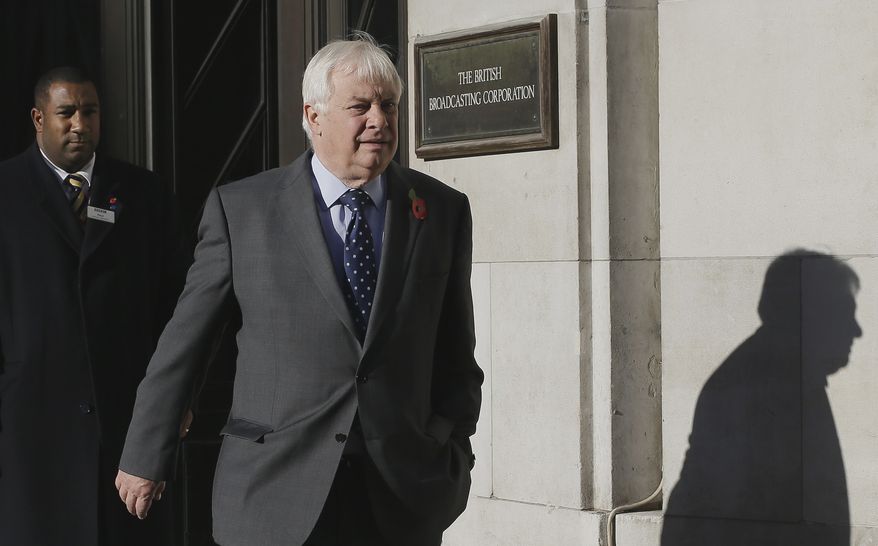 Chris Patten, chairman of the BBC Trust, walks out of the BBC headquarters on Nov. 11, 2012, to give a media interviews in London. The head of the BBC's governing body said Sunday the broadcaster needs a radical overhaul following the resignation of its chief executive in wake of a scandal over a botched report on child sex-abuse allegations. (Associated Press)