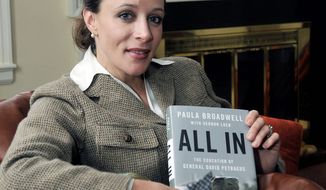 **FILE** Paula Broadwell, author of the David Petraeus biography &quot;All In,&quot; poses for photos in Charlotte, N.C. (Associated Press/The Charlotte Observer, T. Ortega Gaines)