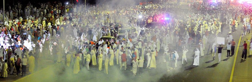 Thousands march on a highway in Kuwait this month to protest a decree by the emir that amends election law. Widening clampdowns on an Islamist-led opposition ahead of parliamentary elections include bans on public gatherings of more than 20 people. The U.S. has about 15,000 ground forces in Kuwait. (Associated Press)