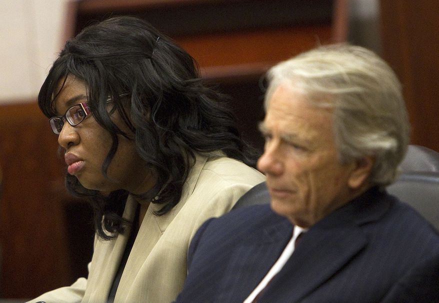 **FILE** Home day care operator Jessica Tata (left) and her attorney, Mike DeGeurin, listen Nov. 12, 2012, to the closing arguments in her murder trial at the Harris County Criminal Justice Center in Houston for the death of Elias Castillo, a 16-month-old killed in a fire at her home day care in Houston. Three other children were also killed. (Associated Press/Houston Chronicle, Johnny Hanson)