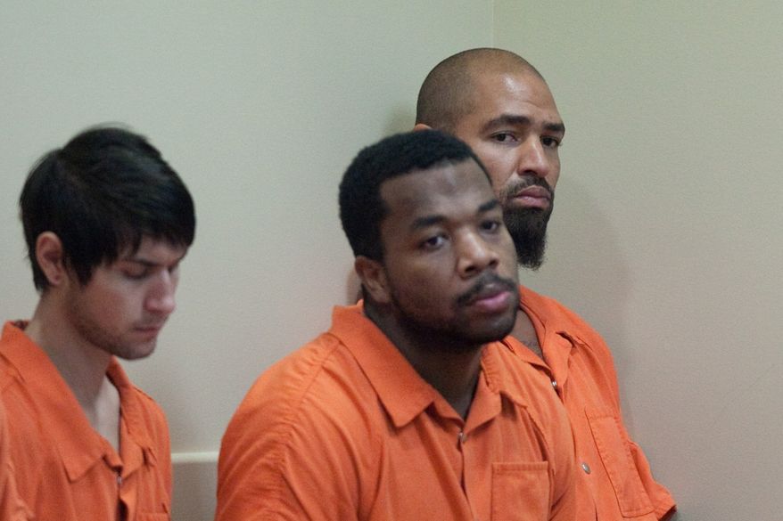 Former Seattle Seahawks player Jerramy Stevens, far right, listens during a bail hearing for Stevens at Municipal Court in Kirkland, Wash. on Tuesday, Nov. 13, 2012. Stevens appeared in court for a domestic violence probable cause hearing. He was released without conditions by the judge who didn't find probable cause to hold him. (AP Photo/seattlepi.com, Joshua Trujillo)