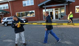**FILE** Federal agents investigate the offices of New England Compounding Center in Framingham, Mass., on Oct. 16, 2012. The company&#39;s steroid medication has been linked to a deadly meningitis outbreak. (Associated Press/The Boston Globe, Barry Chin) 