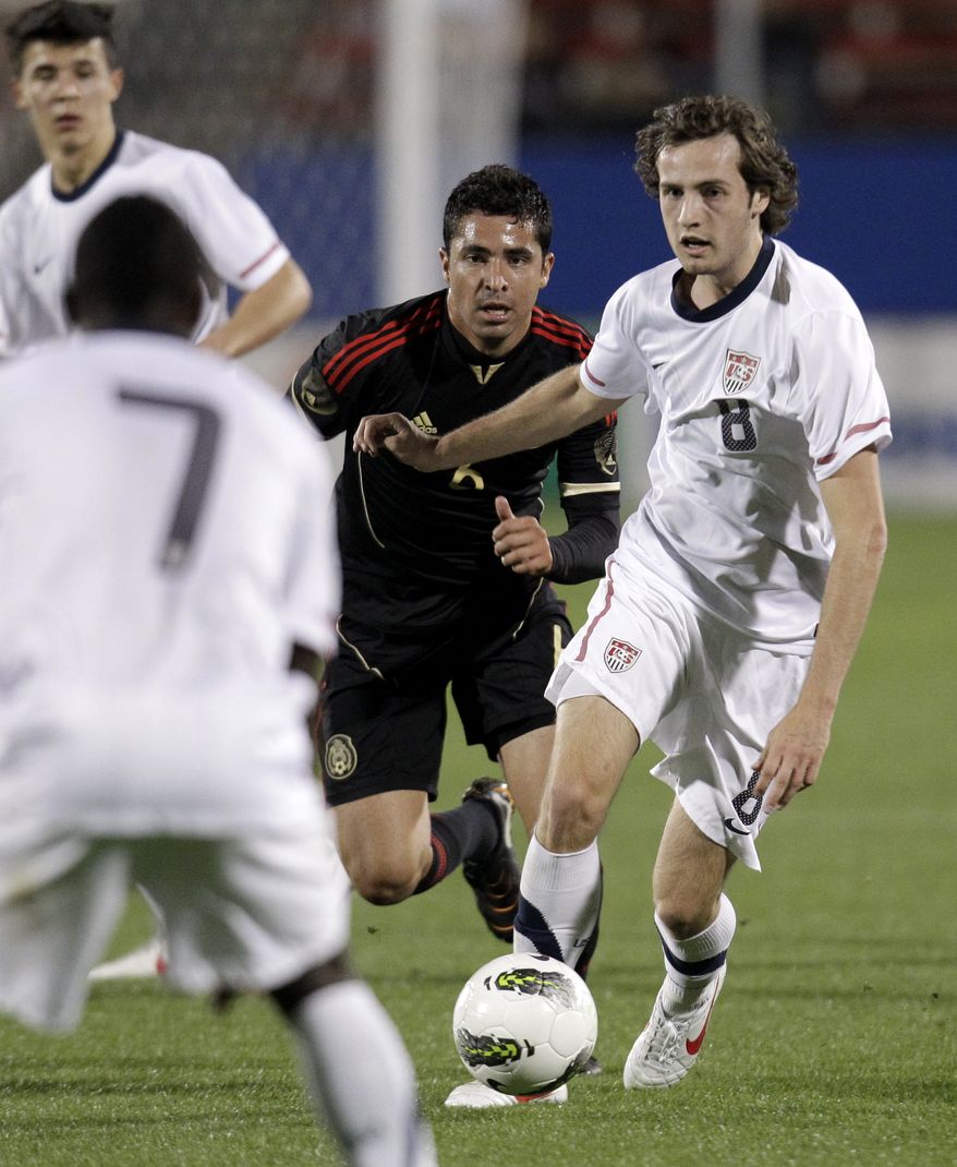 U.S. midfielder Mix Ediskerud (8) of Norway prepares to pass the ball to Freddy Adu (7) as Mexico midfielder Ricardo Bocanegra (6) gives chase in the first half of an under-23 international friendly soccer match at FC Dallas Stadium Wednesday, Feb. 29, 2012, in Frisco, Texas. Diskerud had a goal and an assist within a two-minute span in the first half to lead the Americans in the 2-0 win. (AP Photo/Tony Gutierrez)