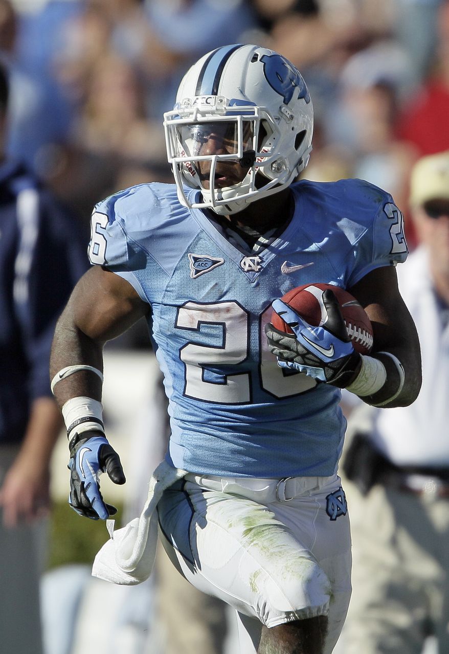 North Carolina's Giovani Bernard (26) runs the ball against Georgia Tech during the second half of an NCAA college football game in Chapel Hill, N.C., Saturday, Nov. 10, 2012. Georgia Tech won 68-50. (AP Photo/Gerry Broome)