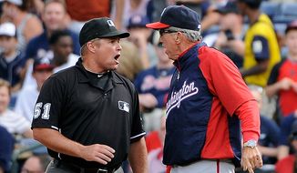 Washington Nationals manager Davey Johnson (right) argues with first base umpire Marvin Hudson before being ejected during the sixth inning of the Nationals&#39; 5-4 road loss to the Atlanta Braves on Sept. 15, 2012. (Associated Press) **FILE**