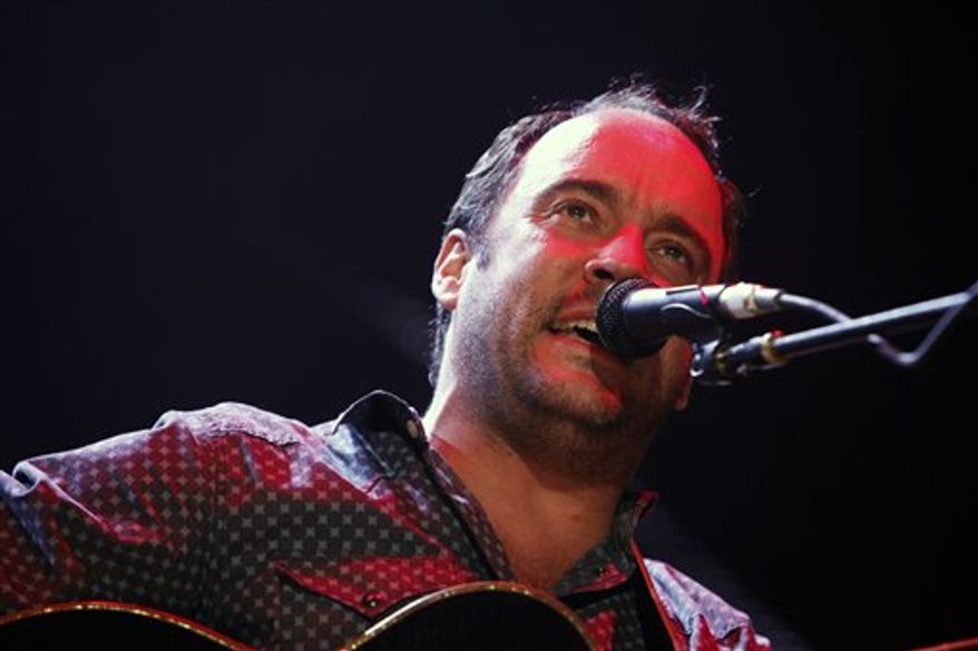 ** FILE ** This Sept. 22, 2012, file photo shows Dave Matthews of the Dave Matthews Band performing during the Farm Aid 2012 concert at Hersheypark Stadium in Hershey, Pa. The band is giving $1 million to help Superstorm Sandy recovery efforts in New Jersey and New York. (AP Photo/Jacqueline Larma, file)