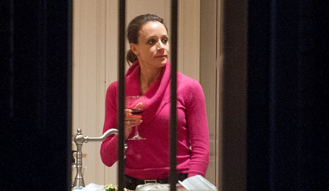 Paula Broadwell holds a drink in the kitchen of her brother&#x27;s house in Washington, Tuesday, Nov. 13, 2012. Broadwell is CIA Director David Petraeus&#x27; biographer, with whom he had an affair that led to his abrupt resignation last Friday. It was Broadwell&#x27;s threatening emails to Jill Kelley, a Florida woman who is a Petraeus family friend, that led to the FBI&#x27;s discovery of communications between Broadwell and Petraeus indicating they were having an affair. (AP Photo/Cliff Owen)