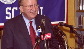 Morgan Wootten, former head basketball coach at DeMatha High School smiles at a press conference to announce his stepping down as coach, Wednesday, Nov. 6, 2002, in Hyattsville, Md. Wootten&#39;s career record is 1,274-192. (AP Photo/Nick Wass)