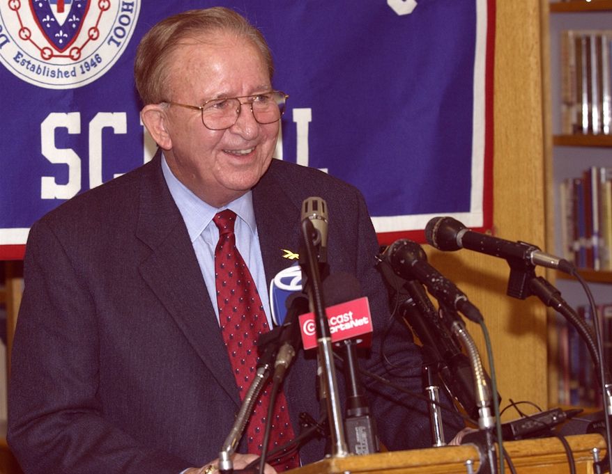 Morgan Wootten, former head basketball coach at DeMatha High School smiles at a press conference to announce his stepping down as coach, Wednesday, Nov. 6, 2002, in Hyattsville, Md. Wootten's career record is 1,274-192. (AP Photo/Nick Wass)