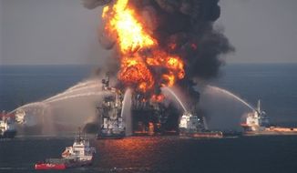 ** FILE ** In this April 21, 2010, file image provided by the U.S. Coast Guard, fire boat response crews battle the blazing remnants of the off shore oil rig Deepwater Horizon. (AP Photo/U.S. Coast Guard, File)
