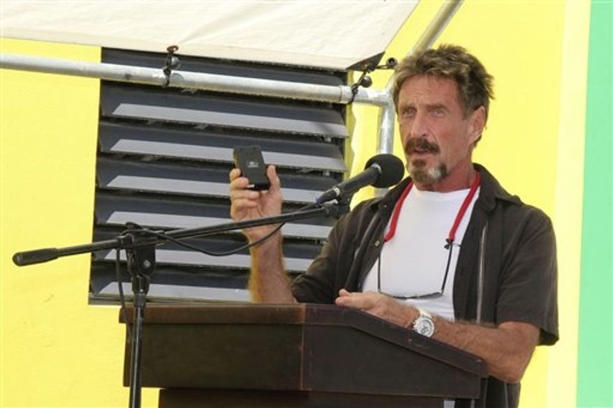 **FILE** Software company founder John McAfee speaks Nov. 8, 2012, at the official presentation of equipment ceremony that took place at the San Pedro Police Station in Ambergris Caye, Belize. (Associated Press/Ambergris Today Online-Sofia Munoz)