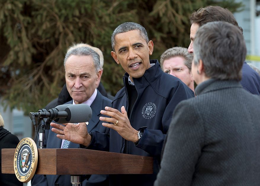 President Barack Obama gestures as he speaks during a news conference on Cedar Grove Avenue, a street significantly impacted by Superstorm Sandy, Thursday, Nov. 15,2012, on Staten Island, in New York. From left are, Sen. Charles Schumer, D-N.Y., the president, Housing and Urban Development Secretary Shaun Donovan, New York Gov. Andrew Cuomo and Homeland Security Secretary Janet Napolitano. (AP Photo/Carolyn Kaster)