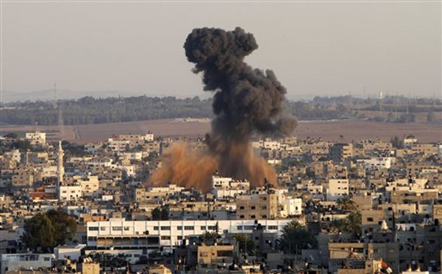 Smoke rises following an Israeli attack on Gaza City, Thursday, Nov. 15, 2012. (AP Photo/Hatem Moussa)