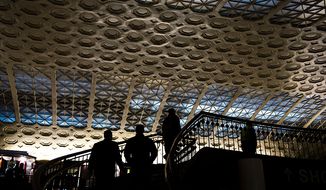 ** FILE ** People are silhouetted against the decorative ceiling and winding staircase in Union Station in Washington, D.C., Tuesday, Nov. 13, 2012. (Rod Lamkey Jr./The Washington Times) ** FILE **