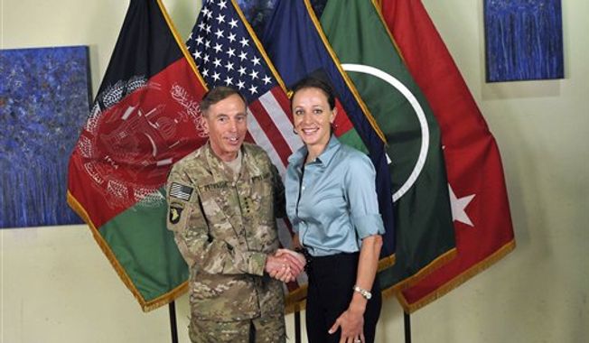 ** FILE ** This July 13, 2011, photo made available on the International Security Assistance Force&#x27;s Flickr website shows U.S. Army Gen. David H. Petraeus shaking hands with Paula Broadwell, co-author of &quot;All In: The Education of General David Petraeus.&quot; (AP Photo/International Security Assistance Force)