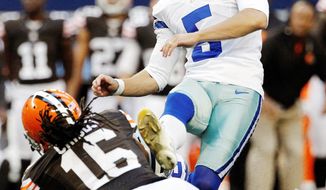 Dallas kicker Dan Bailey follows through on a 32-yard field goal with 2 seconds left in regulation. Bailey hit from 38 yards in overtime to seal a 23-20 comeback victory over Cleveland. (Associated Press)