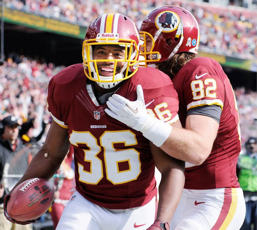 Washington Redskins fullback Darrel Young (36) celebrates his first-quarter touchdown with tight end Logan Paulsen (82) at FedEx Field, Landover, Md., Nov. 18, 2012. (Preston Keres/Special to The Washington Times)