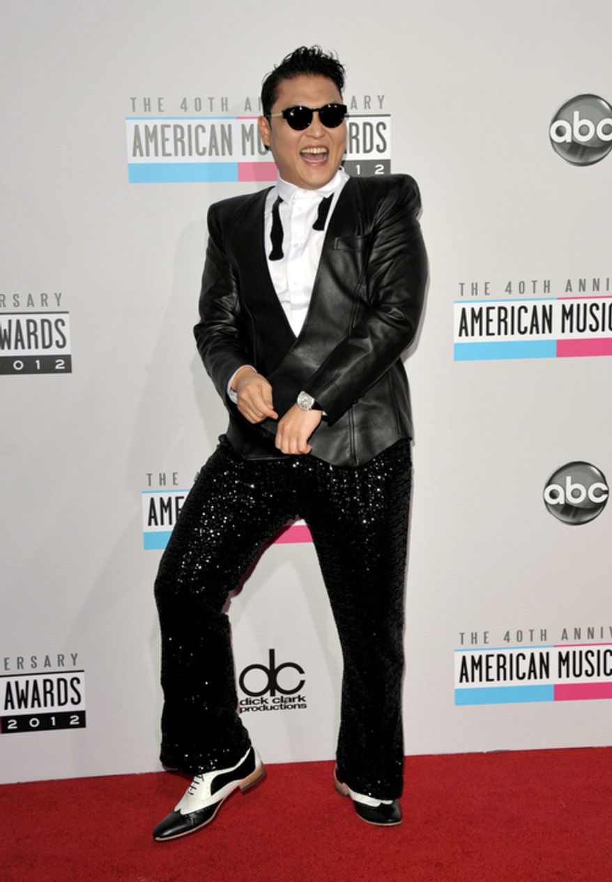South Korean rapper PSY arrives at the 40th Anniversary American Music Awards on Sunday, Nov. 18, 2012, in Los Angeles. (Photo by John Shearer/Invision/AP)