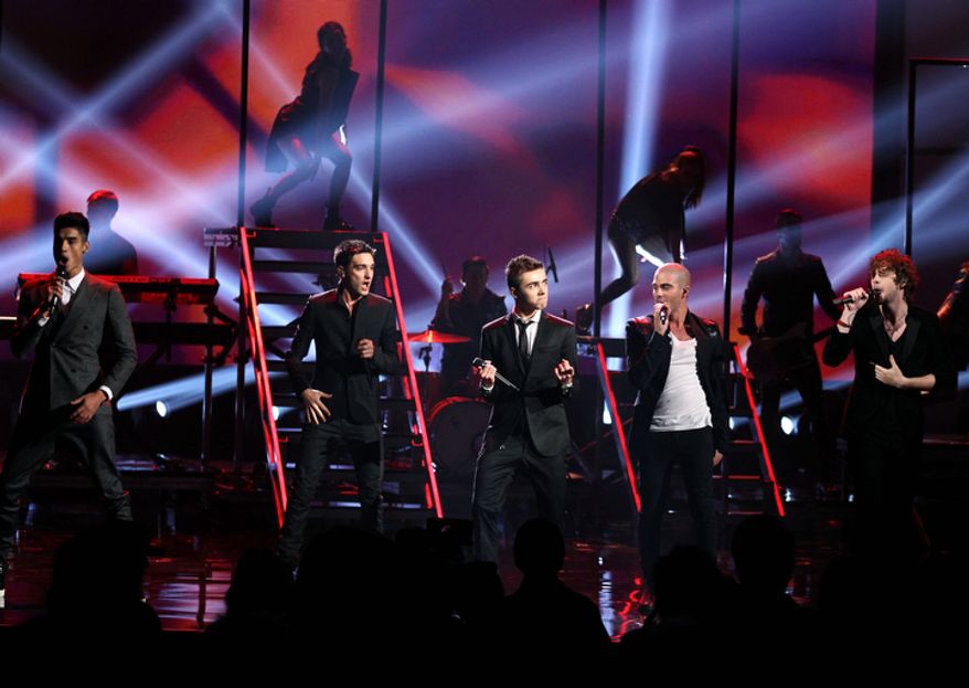 CORRECTS POSITIONS - The Wanted, from left, Siva Kaneswaran,Tom Parker, Nathan Sykes, Max George and Jay McGuiness perform at the 40th Annual American Music Awards on Sunday, Nov. 18, 2012, in Los Angeles. (Photo by Matt Sayles/Invision/AP)