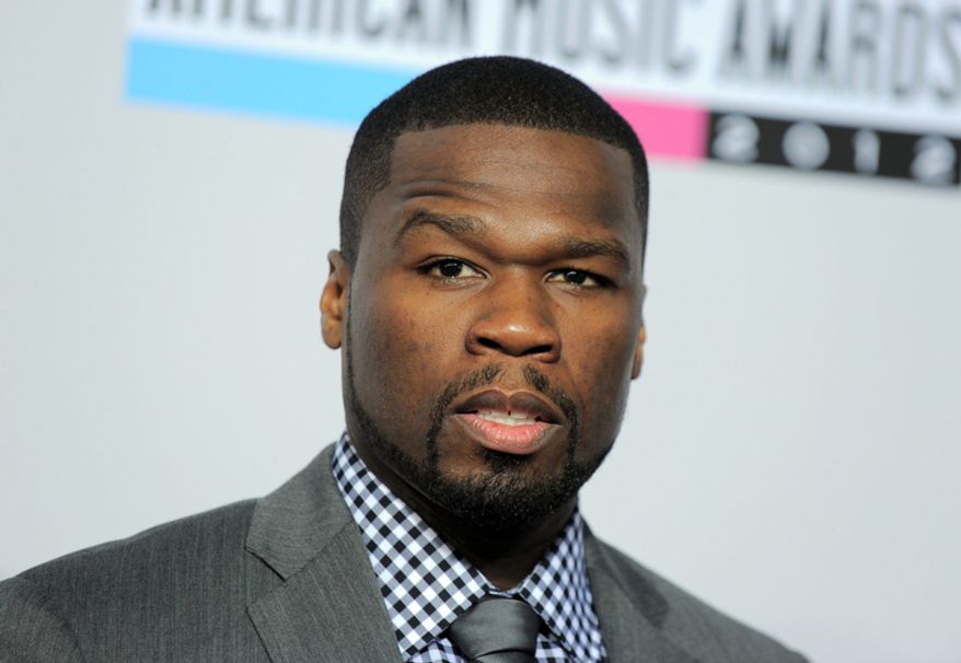 50 Cent, born Curtis Jackson, arrives at the 40th Anniversary American Music Awards on Sunday, Nov. 18, 2012, in Los Angeles. (Photo by Jordan Strauss/Invision/AP)