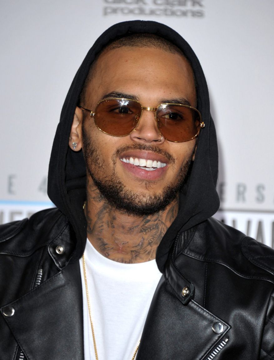 Chris Brown arrives at the 40th Anniversary American Music Awards on Sunday, Nov. 18, 2012, in Los Angeles. (Photo by John Shearer/Invision/AP)