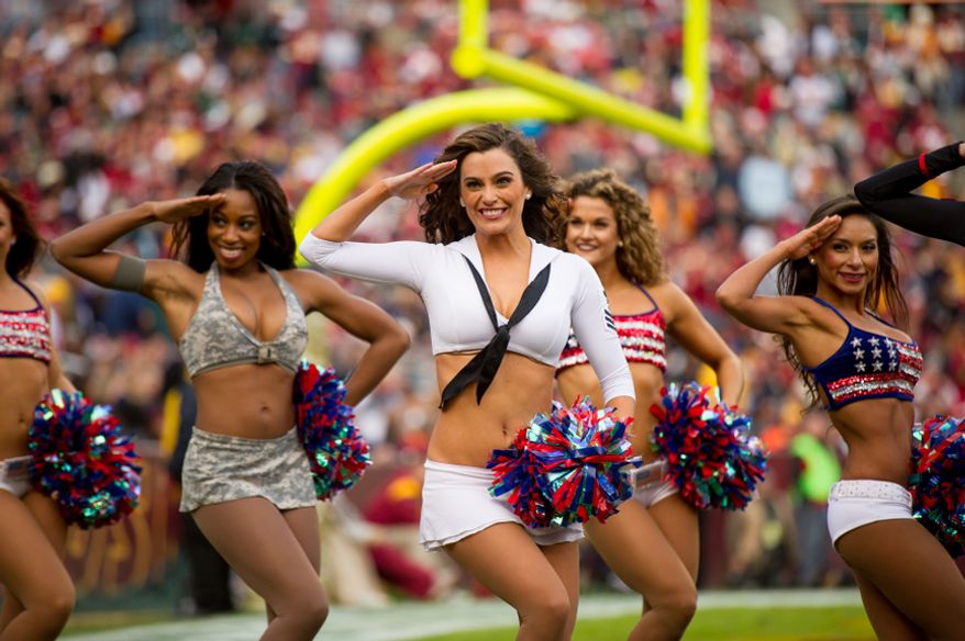 Washington Redskins cheerleaders perform in military style costumes as part of the NFL's military salute to service as the Washington Redskins play the Philadelphia Eagles at FedEx Field, Landover, Md., Sunday, Nov. 18, 2012. (Andrew Harnik/The Washington Times)