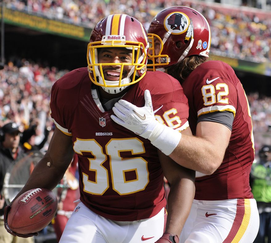 Washington Redskins fullback Darrel Young (36) celebrates his first-quarter touchdown with tight end Logan Paulsen (82) at FedEx Field, Landover, Md., Nov. 18, 2012. (Preston Keres/Special to The Washington Times)