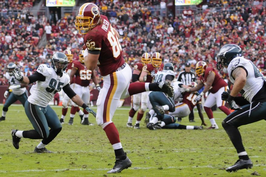 Washington Redskins tight end Logan Paulsen (82) hauls in a 17-yard touchdown pass from quarterback Robert Griffin III (10) at FedEx Field, Landover, Md., Nov. 18, 2012. (Preston Keres/Special to The Washington Times)