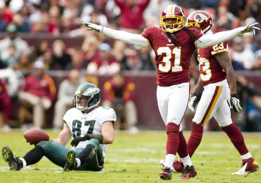 Washington Redskins defensive back Brandon Meriweather (31) celebrates after forcing an incomplete pass intended for Philadelphia Eagles tight end Brent Celek (87) in the second half, Landover, Md., Sunday, November 18, 2012. (Craig Bisacre/The Washington Times)