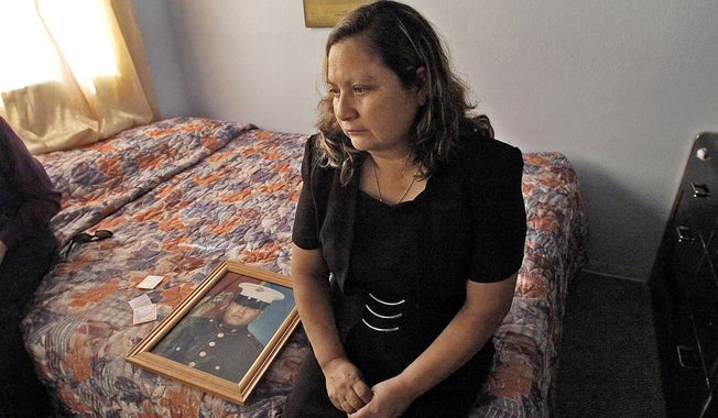 Rosa Maria Peralta visits her son’s bedroom at her home in San Diego shortly after his death. Sgt. Rafael Peralta was killed in action in Fallujah, Iraq, in 2004. (San Diego Union-Tribune)