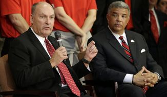 Big Ten Commissioner James Delany, left, speaks at a news conference to announce the University of Maryland&#39;s decision to move to the Big Ten in College Park, Md., Monday, Nov. 19, 2012. Seated alongside Delany is Maryland athletic director Kevin Anderson. Maryland is joining the Big Ten, leaving the Atlantic Coast Conference in a shocker of a move in the world of conference realignment that was driven by the school&#39;s budget woes. (AP Photo/Patrick Semansky)
