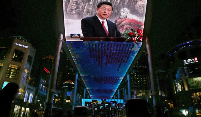 **FILE** A huge screen shows a broadcast of China&#x27;s new Communist Party General Secretary Xi Jinping speaking in Beijing&#x27;s Great Hall of the People on Nov. 15, 2012. (Associated Press)