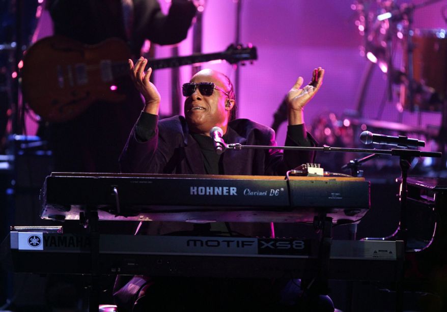 Stevie Wonder and the Rickey Minor Band perform "Master Blaster," "My Cherie Amour" and "Sir Duke" during a tribute to Dick Clark at the 40th Anniversary American Music Awards in Los Angeles on Nov. 18, 2012. (John Shearer/Invision/Associated Press)