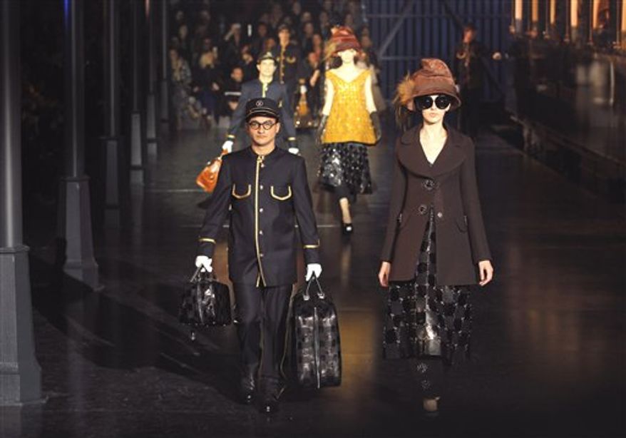 ** FILE ** This March 7, 2012 photo shows a model wearing a creation by U.S fashion designer Marc Jacobs for his Louis Vuitton collection, Women's Fall-Winter, ready-to-wear 2013 during Paris Fashion week. Polished sophistication is the new trend after previous trends that have alternately favored bohemian, aggressive and blingy looks. (AP Photo/Jacques Brinon, file)