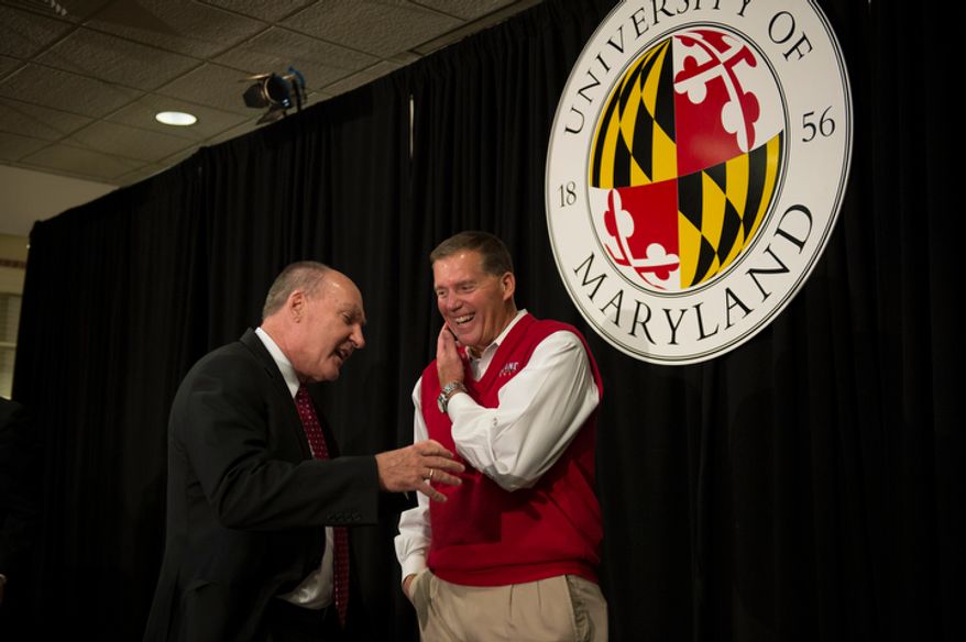 University of Maryland football head coach Randy Edsall (right) chats with Big Ten Commissioner James E. Delany (left) following a press conference to announce the University of Maryland's joining the Big Ten Conference, at the University of Maryland in College Park, Md., Monday, Nov. 19, 2012. (Rod Lamkey Jr./The Washington Times)