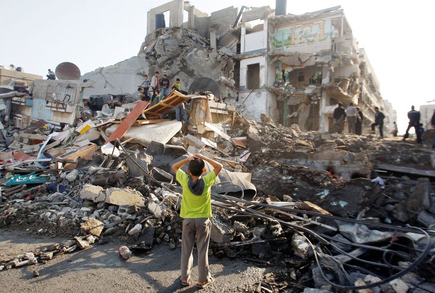 A house in Gaza City was turned to rubble by an Israeli airstrike Tuesday. Efforts to end the week-old convulsion of Israeli-Palestinian violence drew in top diplomats, including appeals from Secretary of State Hillary Rodham Clinton and U.N. Secretary-General Ban Ki-moon. (Associated Press)
