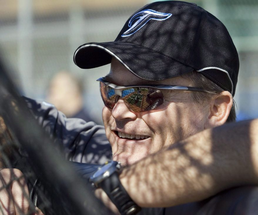 FILE - This Feb. 19, 2008 file photo shows Toronto Blue Jays manager John Gibbons leaning on the batting cage during a spring training workout in Dunedin, Fla. The Blue Jays have hired John Gibbons as manager. The 50-year-old Gibbons returns to the club where he served as manager from 2004-2008. (AP Photo/The Canadian Press, Ryan Remiorz, File)