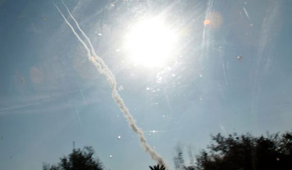 Smoke trails are seen after ordnance was fired Nov. 20, 2012, by Palestinian militants from Gaza towards southern Israel, east of Bureij Refugee Camp in central Gaza Strip. (Associated Press)