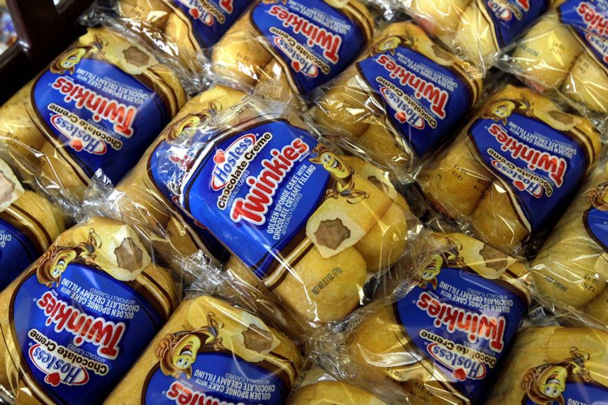 **FILE** Twinkies baked goods are displayed for sale Nov. 16, 2012, at the Hostess Brands' bakery in Denver. (Associated Press)
