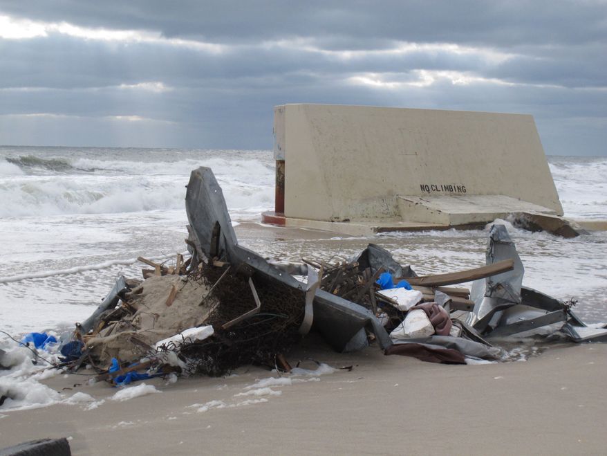Waves bash against a sewage outfall structure in Point Pleasant Beach N.J. on Nov. 15, 2012. Before Superstorm Sandy caused massive beach erosion at the Jersey shore, the outfall had about 50 feet of beach between it and the ocean. Superstorm Sandy took a bite out of the Jersey shore, washing away millions of tons of sand and slimming down beaches along the state's 127-mile coastline. (Associated Press)
