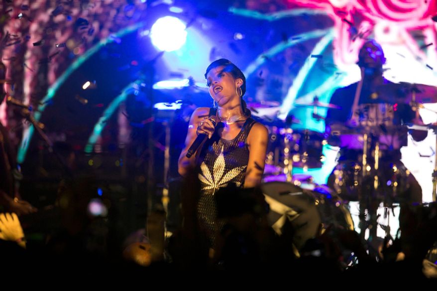 Barbadian singer Rihanna performs during the fifth stop of her worldwide "777" tour at the E-Werk club in Berlin on Nov. 19, 2012. (Associated Press)
