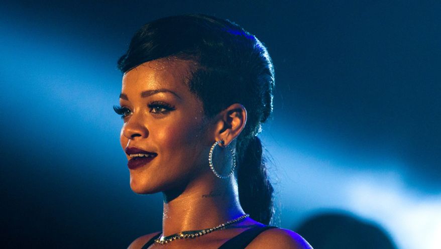 Barbadian singer Rihanna performs during the fifth stop of her worldwide "777" tour at the E-Werk club in Berlin on Nov. 19, 2012. (Associated Press)