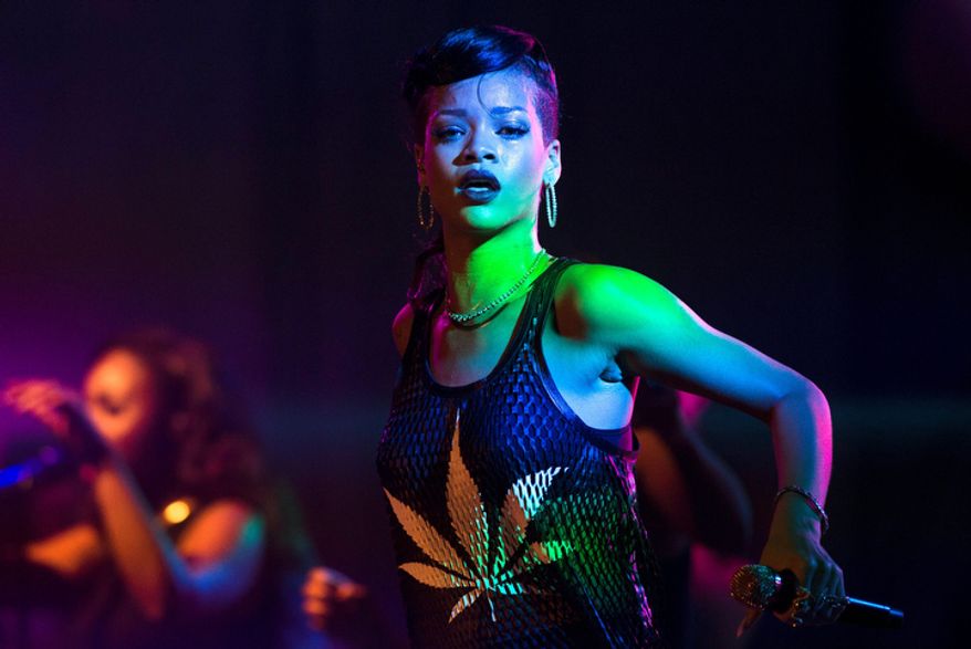 Barbadian singer Rihanna performs during the fifth stop of her "777" worldwide tour at the E-Werk club in Berlin on Nov. 19, 2012. (Associated Press)