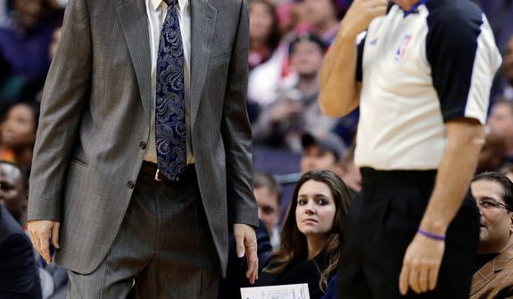 Washington Wizards coach Randy Wittman talks with an official during the first half of the Pacers&#39; 96-89 road win on Nov. 19, 2012. (Associated Press)