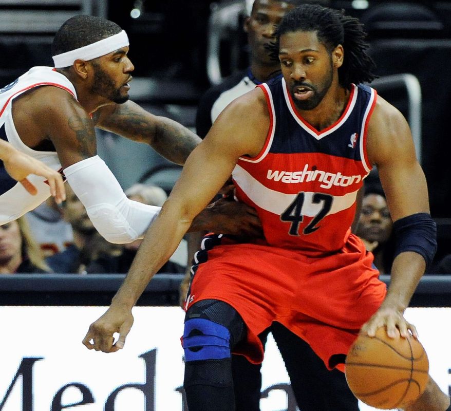 Nene came off the bench to score 12 points in 19:43 during the Wizards' 101-100 overtime loss in Atlanta on Wednesday night. (Associated Press)