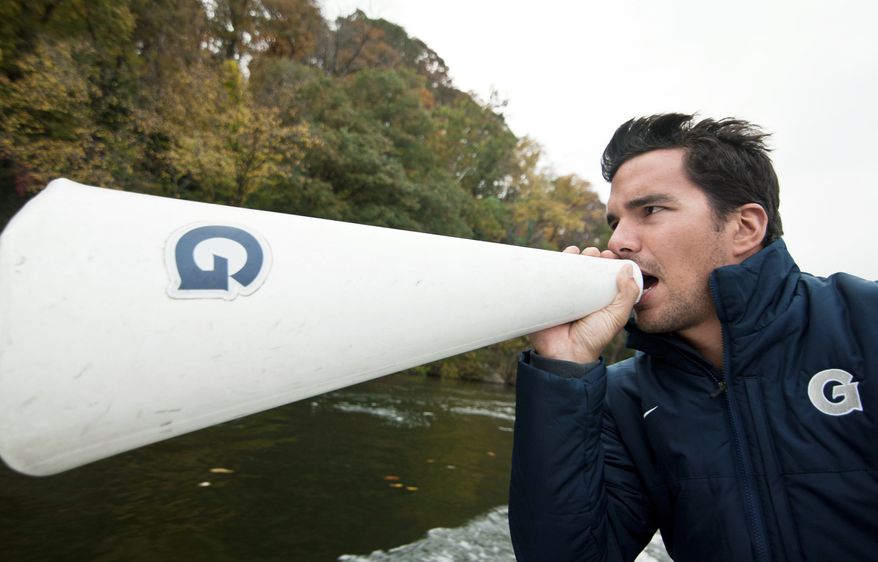 Georgetown crew coach, Giuseppe Lanzone, trains his team on the Potomac River, Washington, D.C., Oct. 26, 2012. (Craig Bisacre/The Washington Times)