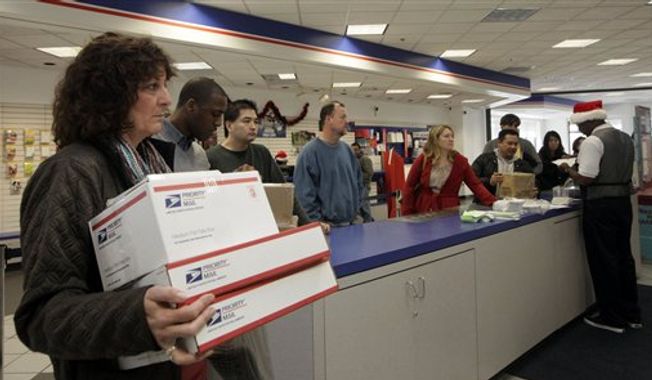 **FILE** People wait in line at the U.S. Postal Service Airport station in Los Angeles on Dec. 19, 2011. (Assocaited Press)