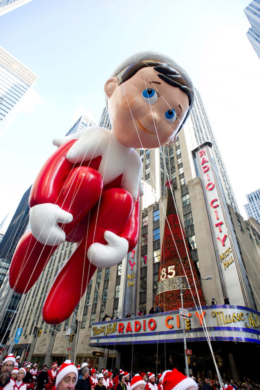The Elf on the Shelf balloon floats in the Macy's Thanksgiving Day Parade in New York, Thursday, Nov. 22, 2012. The annual Macy's Thanksgiving Day Parade put a festive mood in the air in a city still coping with the aftermath of Superstorm Sandy (AP Photo/Charles Sykes)
