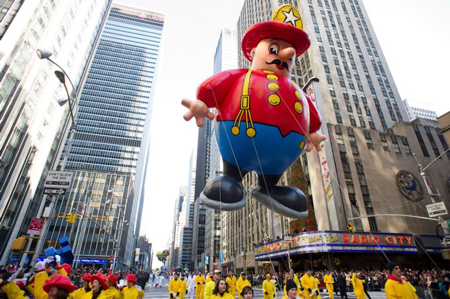 The Harold the Fireman balloon floats in the Macy's Thanksgiving Day Parade in New York in New York, Thursday, Nov. 22, 2012. The annual Macy's Thanksgiving Day Parade kicked off in New York on Thursday, putting a festive mood in the air in a city still coping with the aftermath of Superstorm Sandy. (AP Photo/Charles Sykes)