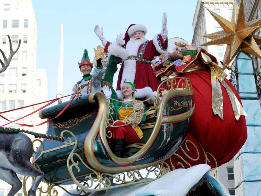 Santa Claus waves to the crowd at Herald Square during the 86th annual Macy's Thanksgiving Day Parade,Thursday, Nov 22, 2012, in New York (AP Photo/ Louis Lanzano)